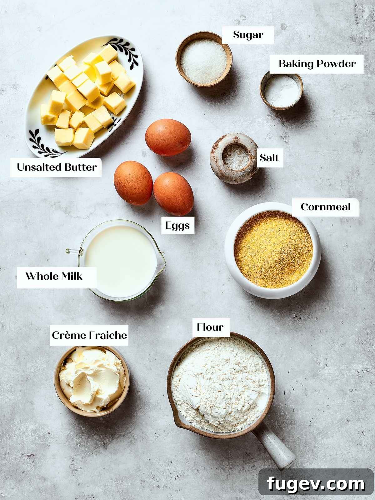 Southern Cornbread Perfection 3 All precisely measured cornbread ingredients, including flour, cornmeal, eggs, butter, and milk, neatly arranged on a kitchen counter before mixing.