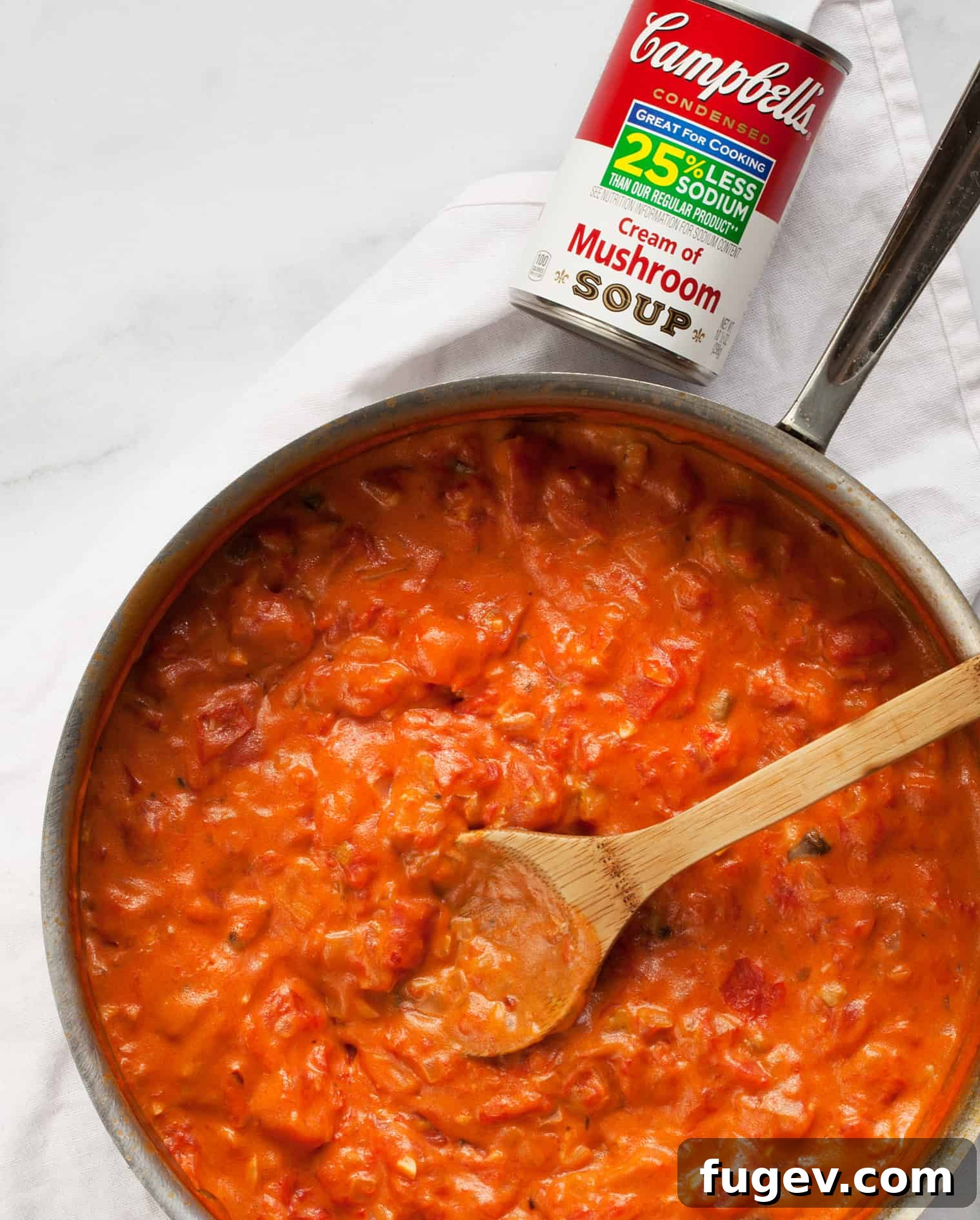 Velvety Mushroom and Tomato Pasta 7 Creamy tomato mushroom sauce simmering in a skillet, vibrant and thick