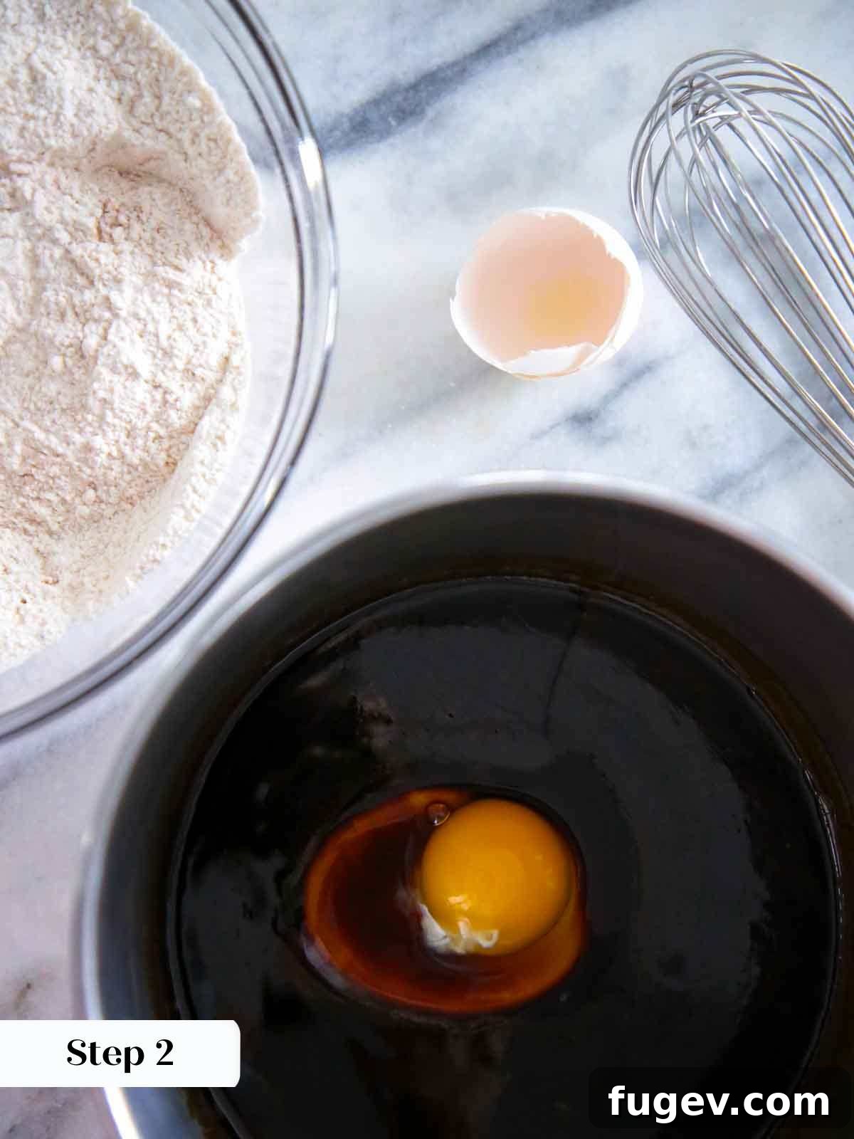 Holiday Spice Drops 6 cooling molasses mixture with egg added, in a pot.