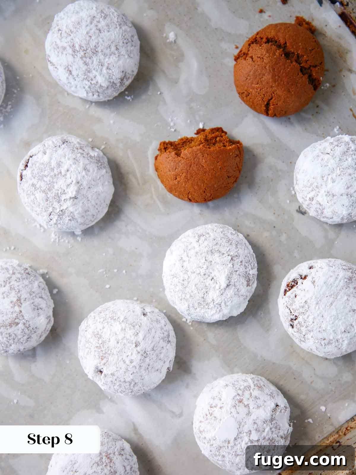 Holiday Spice Drops 10 powdered sugar coated pfeffernusse cookies on a serving tray.