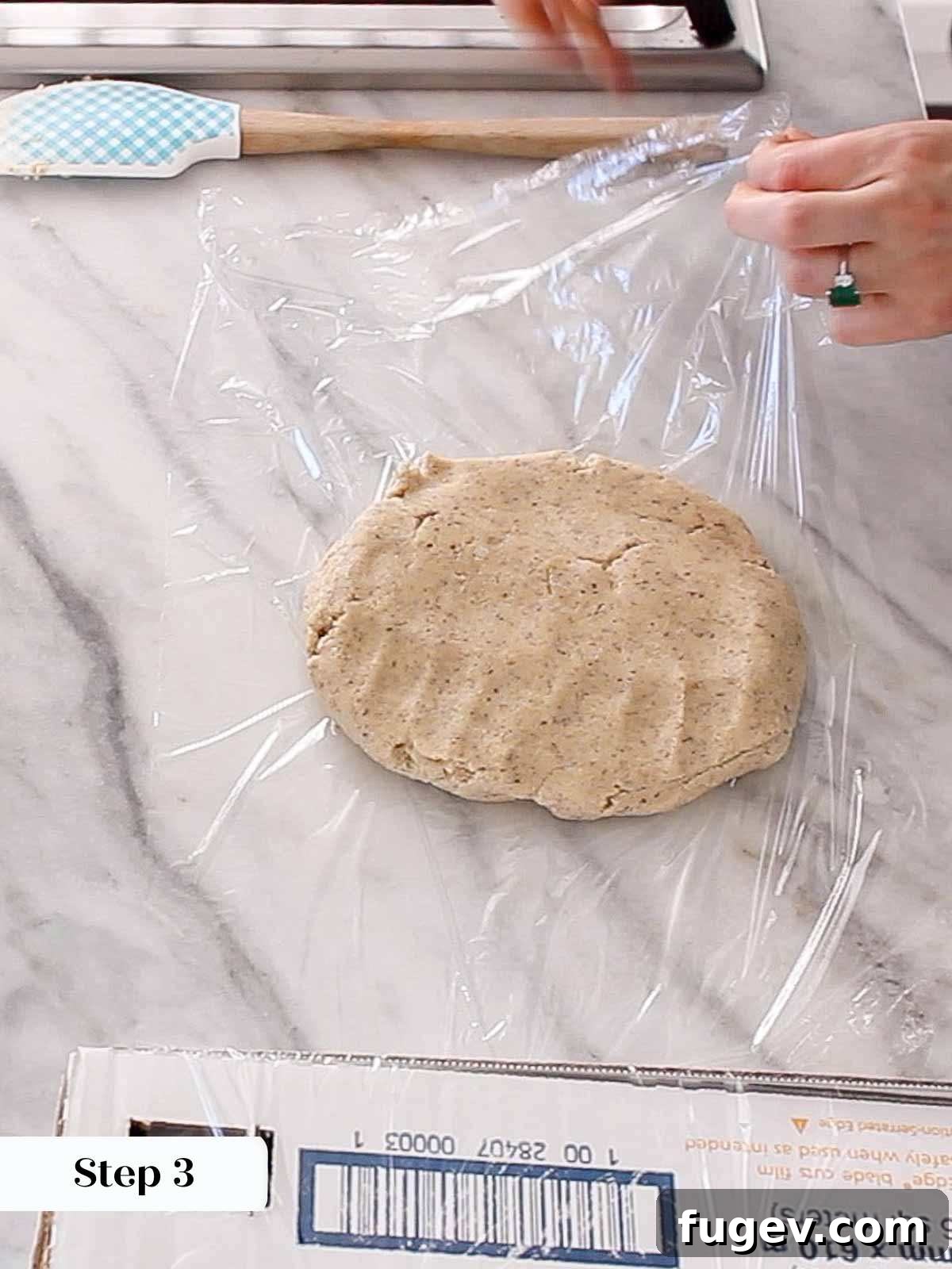 Velvet Almond Crescents 7 wrapping dough in plastic wrap.
