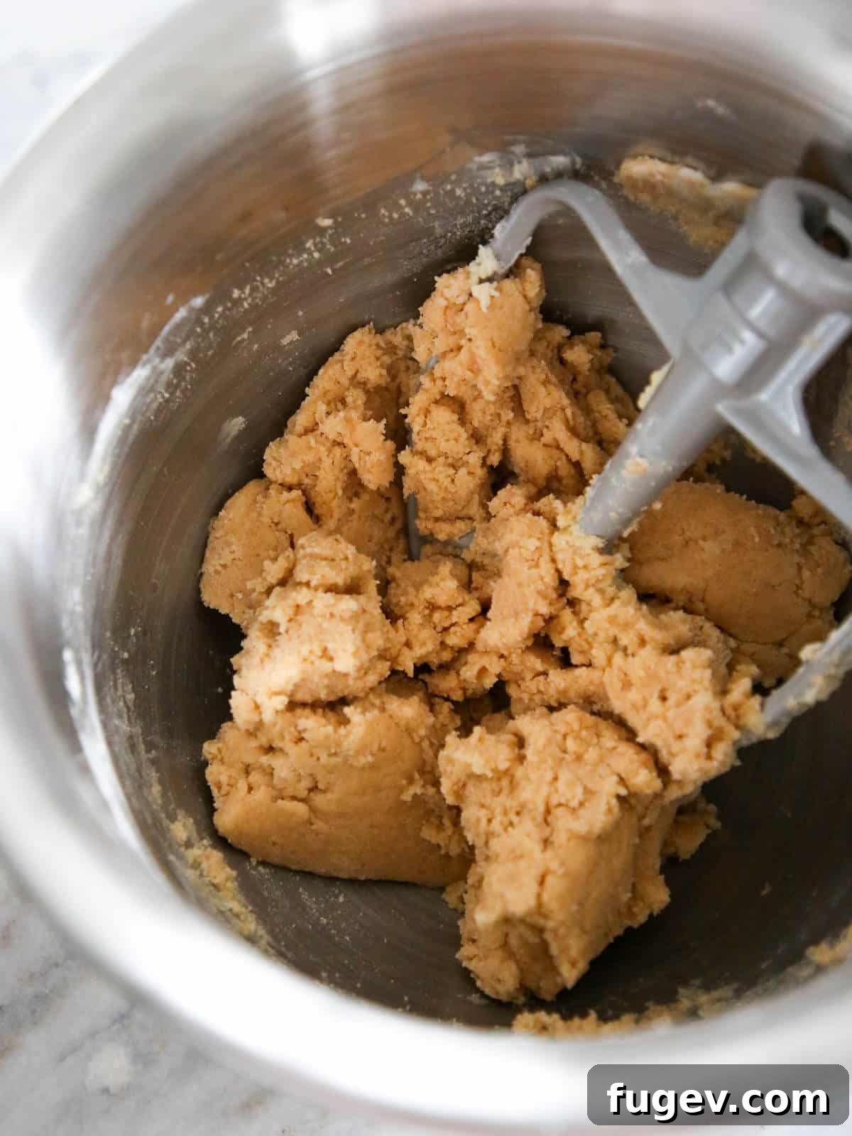 Golden Almond Squares 4 Cookie batter in a silver stand mixer bowl.
