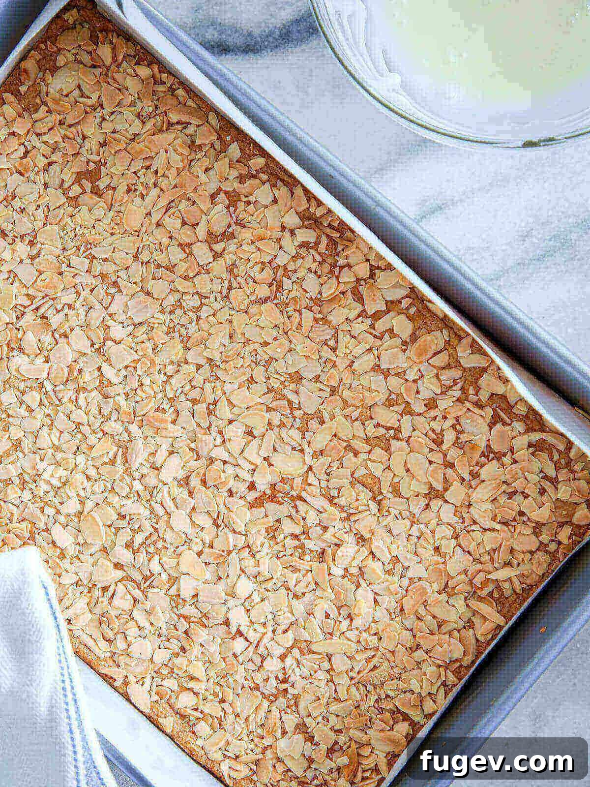 Golden Almond Squares 6 Baked cookies in bar form with crispy almond tops.