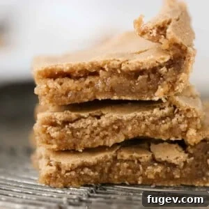 Stacked butterscotch brownies, showcasing their golden hue and inviting texture.