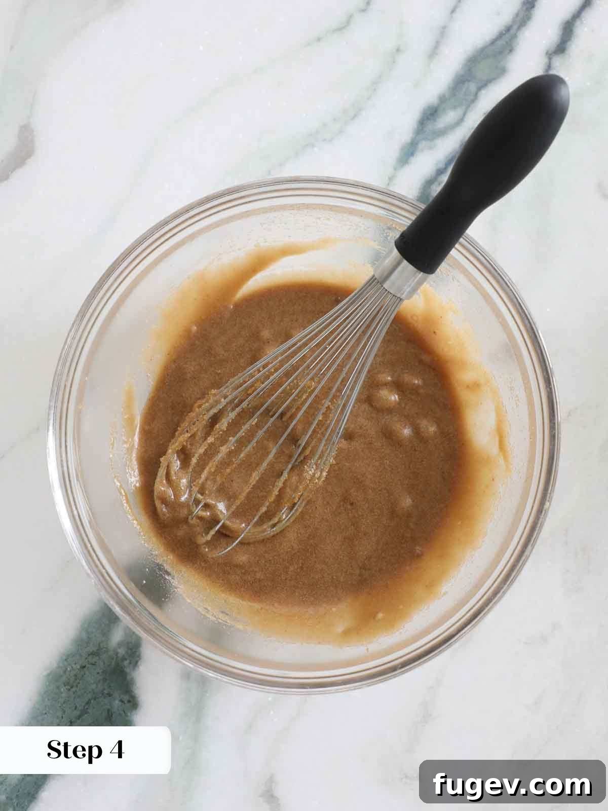 Butterscotch Blondies 8 Wet ingredients (butter, sugar, eggs, vanilla) perfectly whisked in a bowl, creating a smooth, glossy mixture for the butterscotch brownie batter.