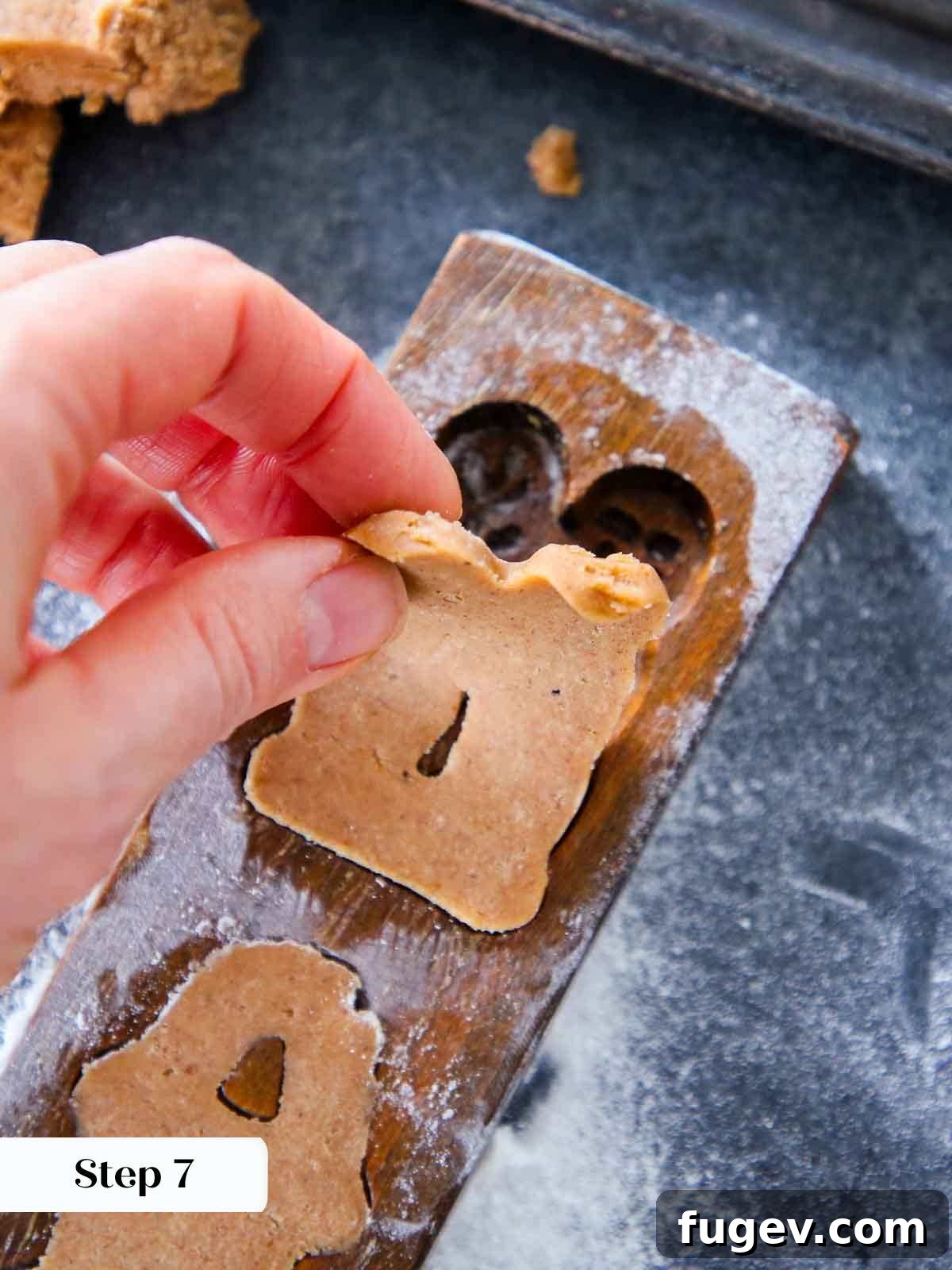 Timeless Speculoos Spice Cookies 6 A perfectly molded cookie being peeled out of the wooden mold.
