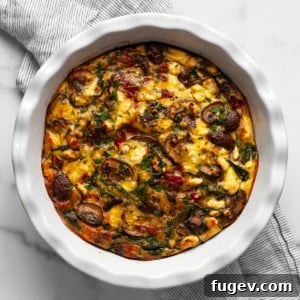 Savory Mushroom, Pepper, and Spinach Frittata 9 Crustless mushroom quiche with peppers, spinach and feta, a close-up showing the golden crust and vibrant filling.