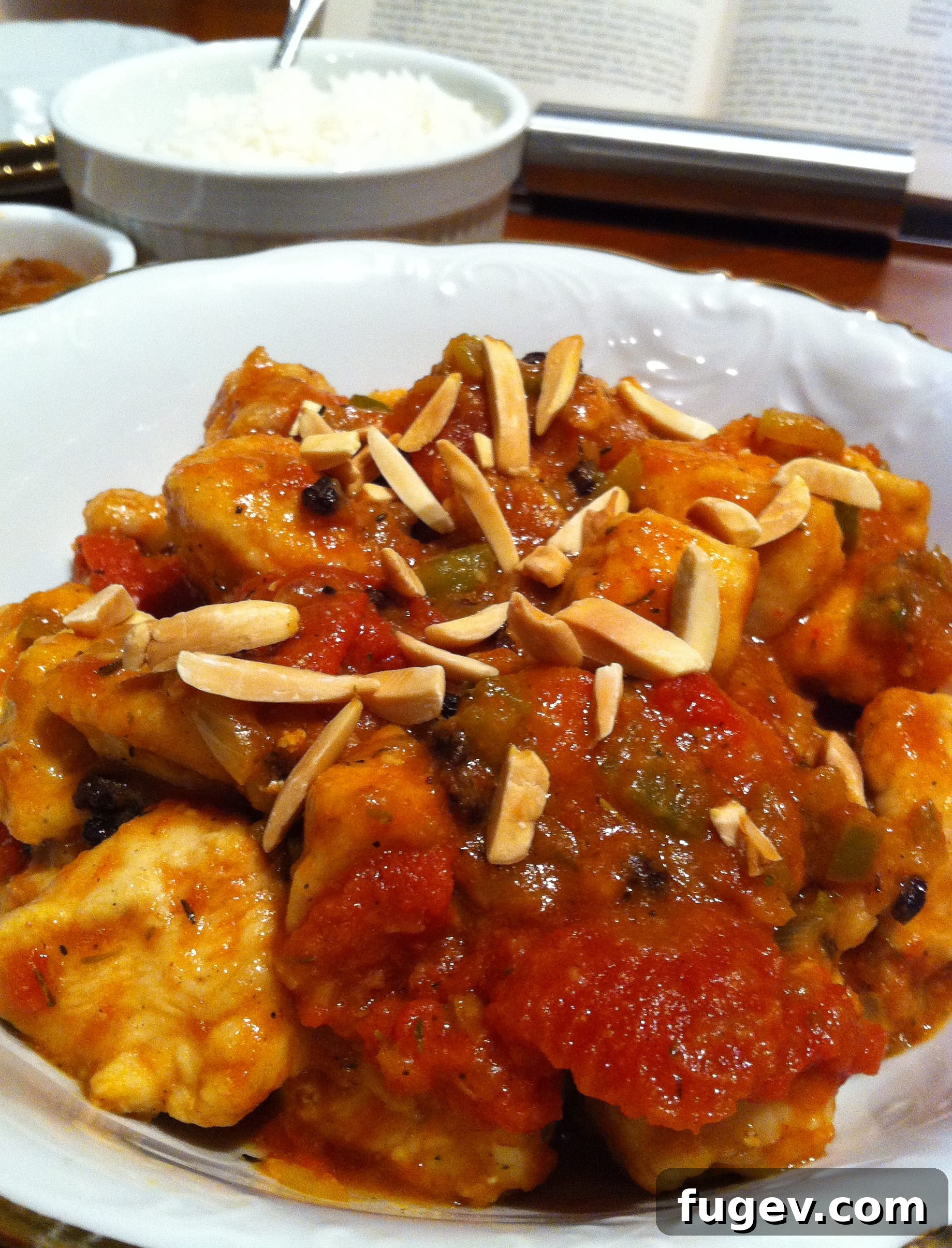 Classic Country Captain Chicken Curry 3 Country Captain Chicken Curry garnished with toasted almonds and fresh cilantro