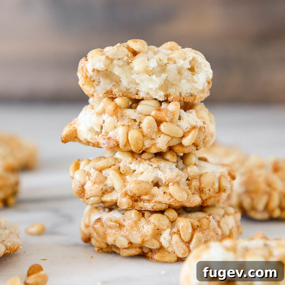 20 Festive Christmas Cookie Recipes 14 Pignoli Cookies stacked interior detail.