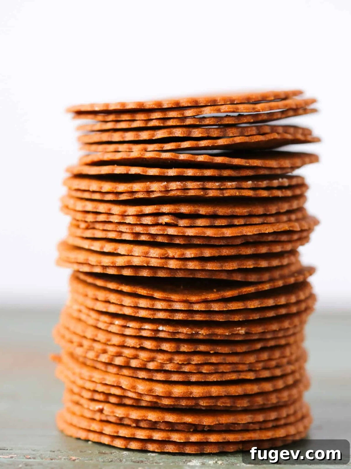 20 Festive Christmas Cookie Recipes 26 Moravian Christmas Cookies stacked tall white background.