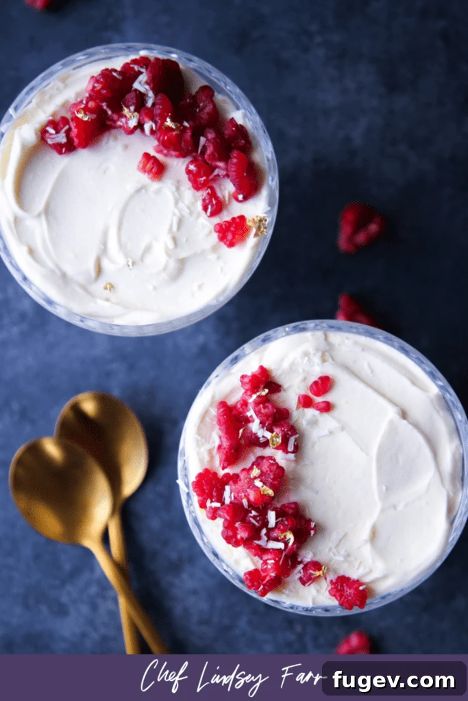 Velvet Raspberry White Chocolate Dream 10 Overhead shot of White Chocolate Raspberry Mousse in a serving dish, garnished with fresh raspberries.