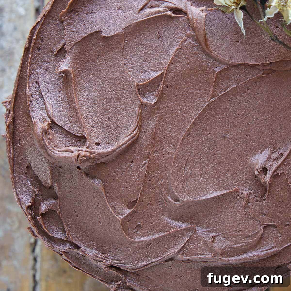 Decadent Chocolate Buttercream 3 Beautifully swirled chocolate buttercream frosting on a cake, highlighting its rich texture and perfect consistency.