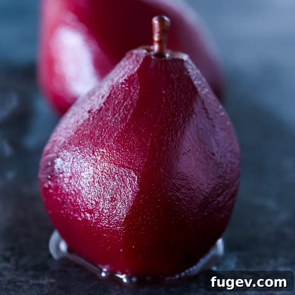 Crimson Poached Pears 2 Red Wine Poached Pears in a bowl