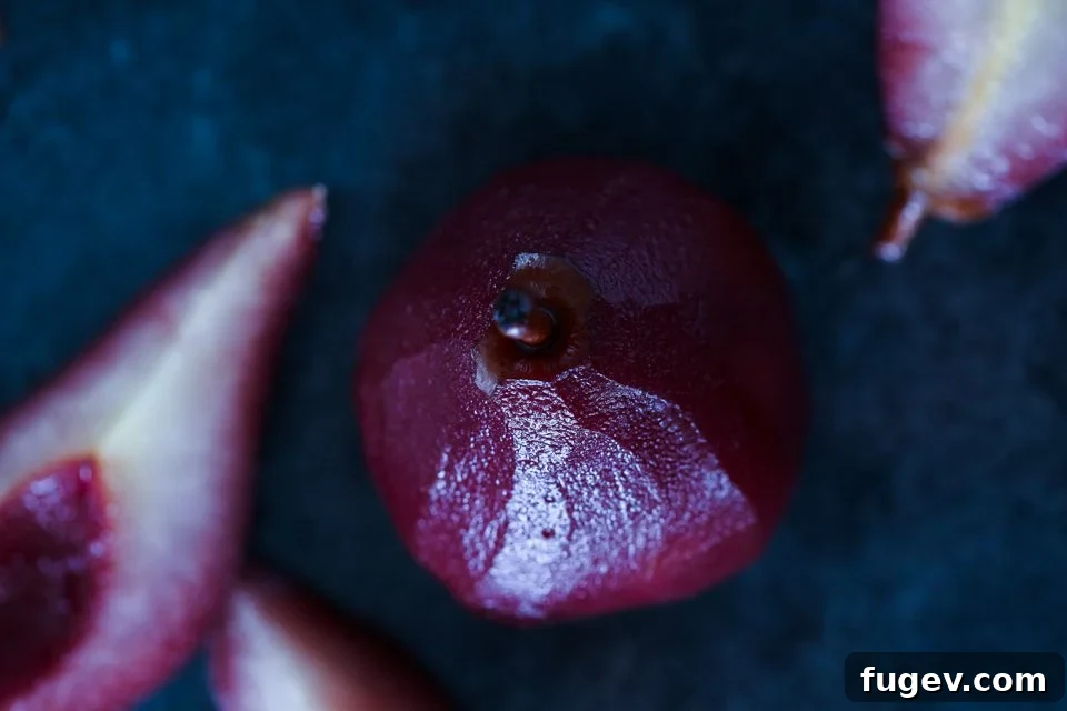 Crimson Poached Pears 4 Close up of a red wine poached pear