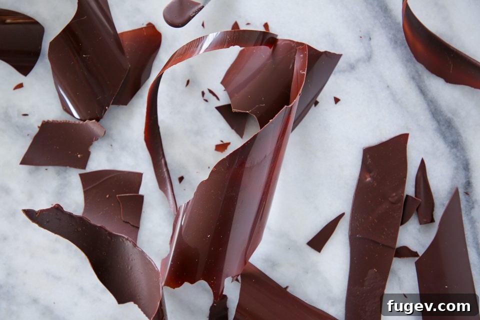 Ice Bath Tempering Your Dark Chocolate to Perfection 4 Melted dark chocolate in a metal bowl for tempering