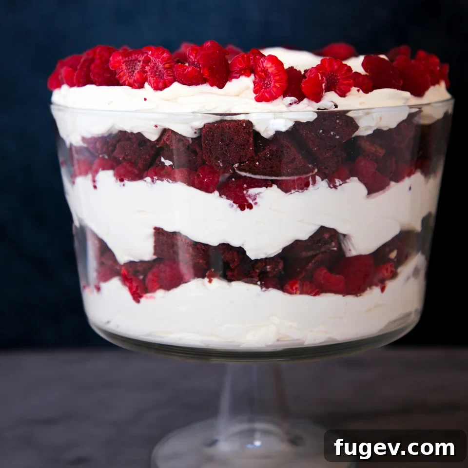Ruby Raspberry Velvet Trifle 2 Vibrant layers of Red Velvet Raspberry Trifle in a glass dish, ready to be served