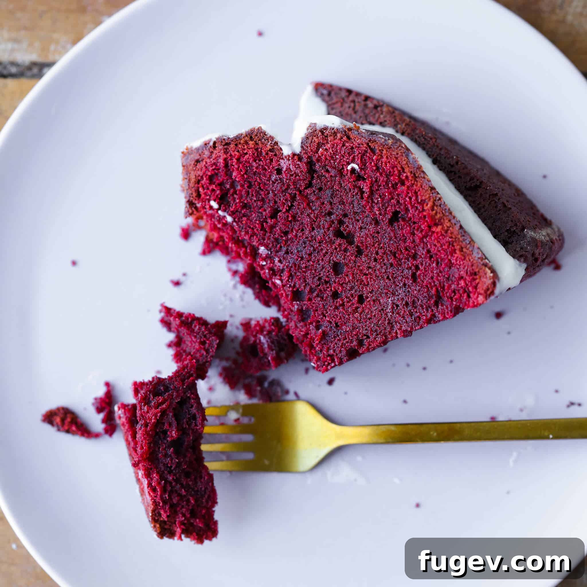Ultimate Red Velvet Loaf Cake 4 Red Velvet Pound Cake with cream cheese glaze, a slice on a plate.