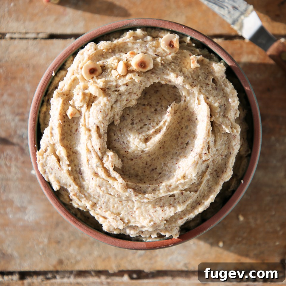 Velvety Hazelnut Cream 5 hazelnut cream swirled decoratively in bowl.