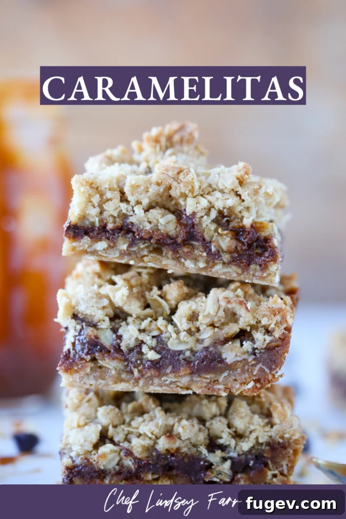 Chewy Caramel Oat Bars 7 Two Caramelita bars on a wooden surface, showing the gooey caramel and chocolate