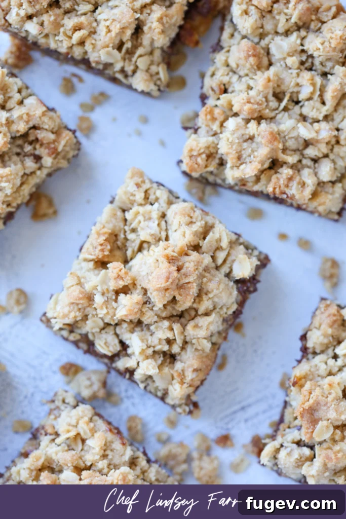 Chewy Caramel Oat Bars 8 Close-up of a single Caramelita bar, with visible oats, caramel, and chocolate