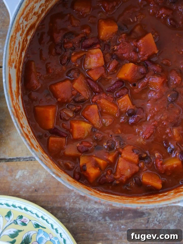 Plant-Powered Chili 2 Delicious vegan chili simmering in a rustic Dutch oven, ready to be served.