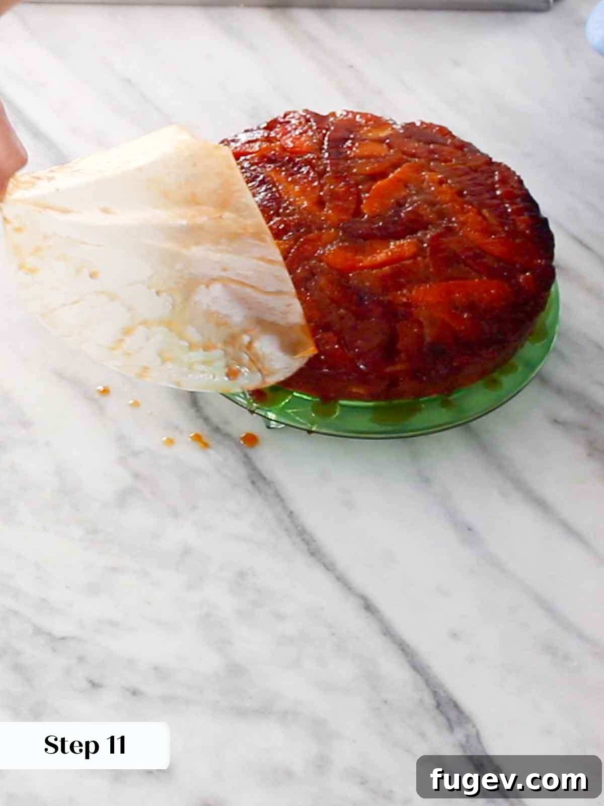 Golden Orange Inversion 14 Removing parchment paper from the top of the freshly flipped upside down cake.