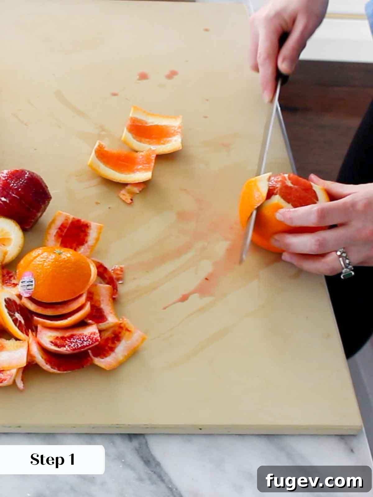 Golden Orange Inversion 4 Chef removing orange peel for supremes.