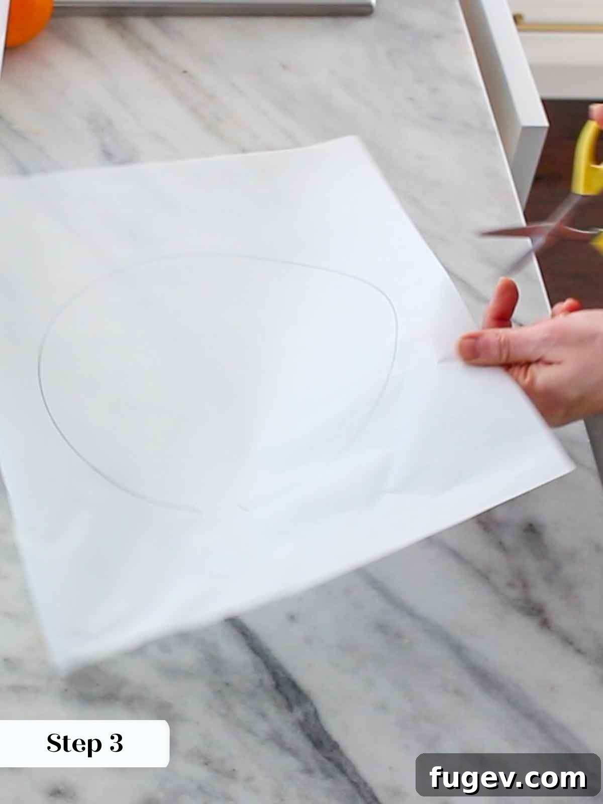 Golden Orange Inversion 6 Cutting parchment paper circle to line cake pan.
