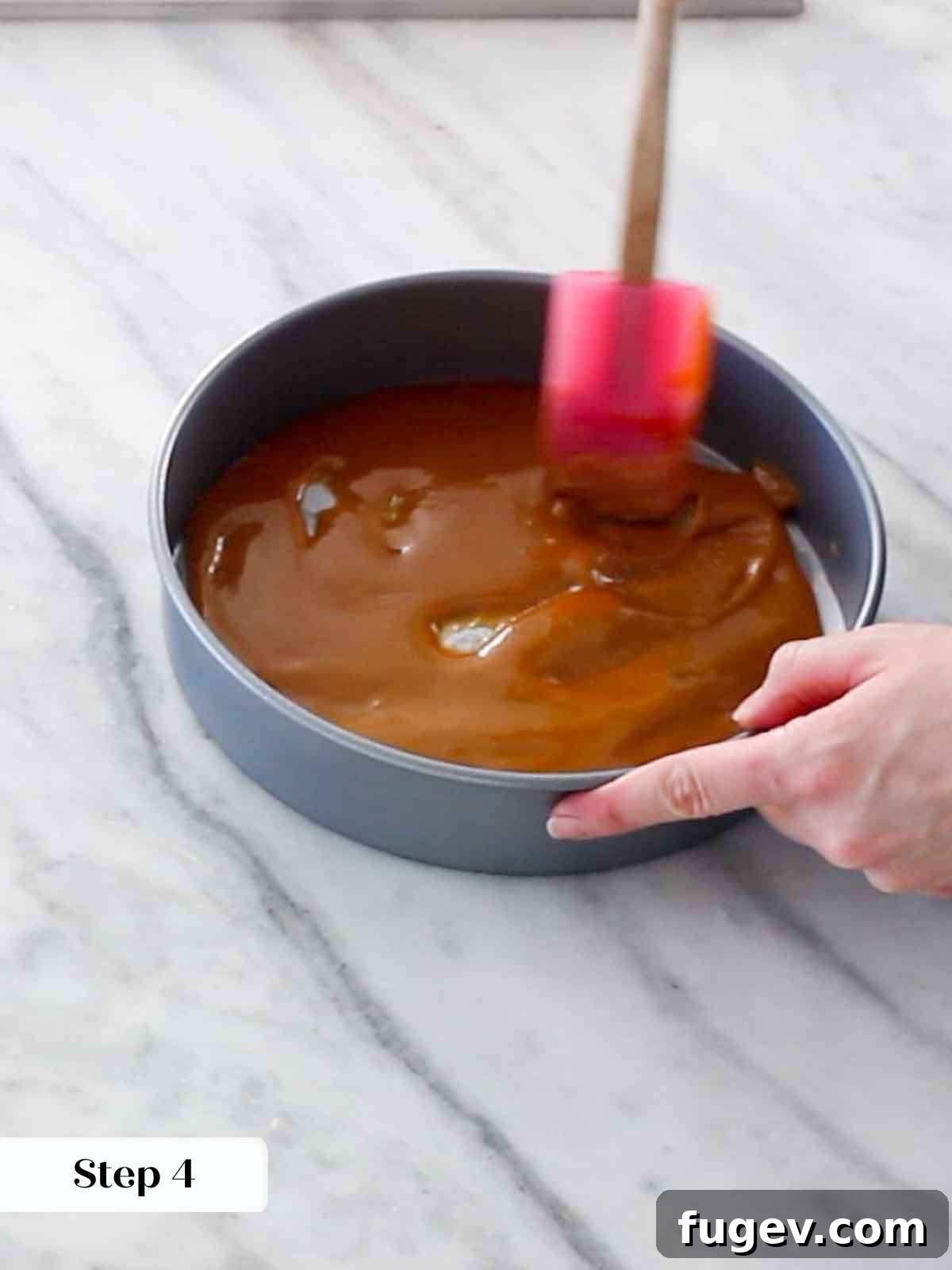 Golden Orange Inversion 8 Warm caramel spread evenly in the bottom of the cake pan for an upside down cake.