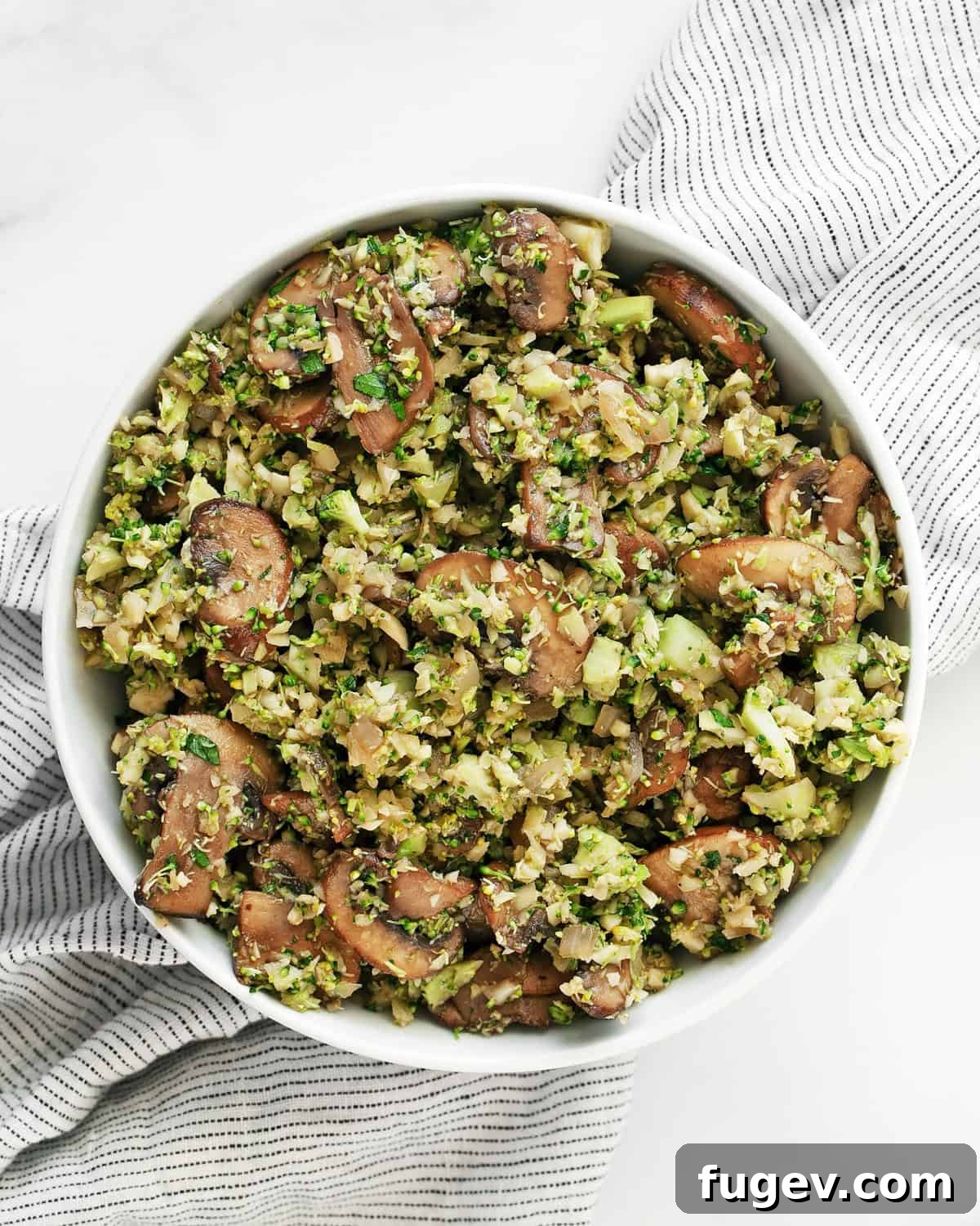 Balsamic Glazed Mushroom and Broccoli Rice 7 A serving of balsamic mushroom broccoli rice presented beautifully in a ceramic bowl, ready to be enjoyed.