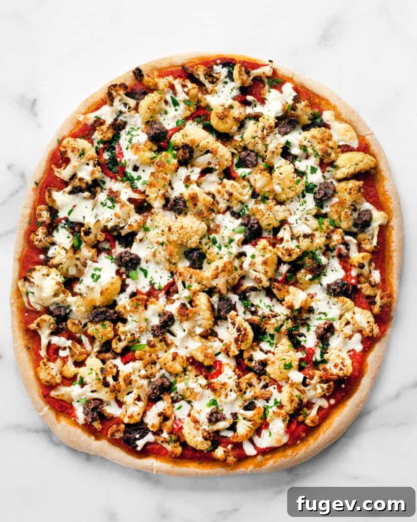 Golden Roasted Cauliflower Tapenade Pizza 3 Close-up of freshly baked pizza with roasted cauliflower and olive toppings