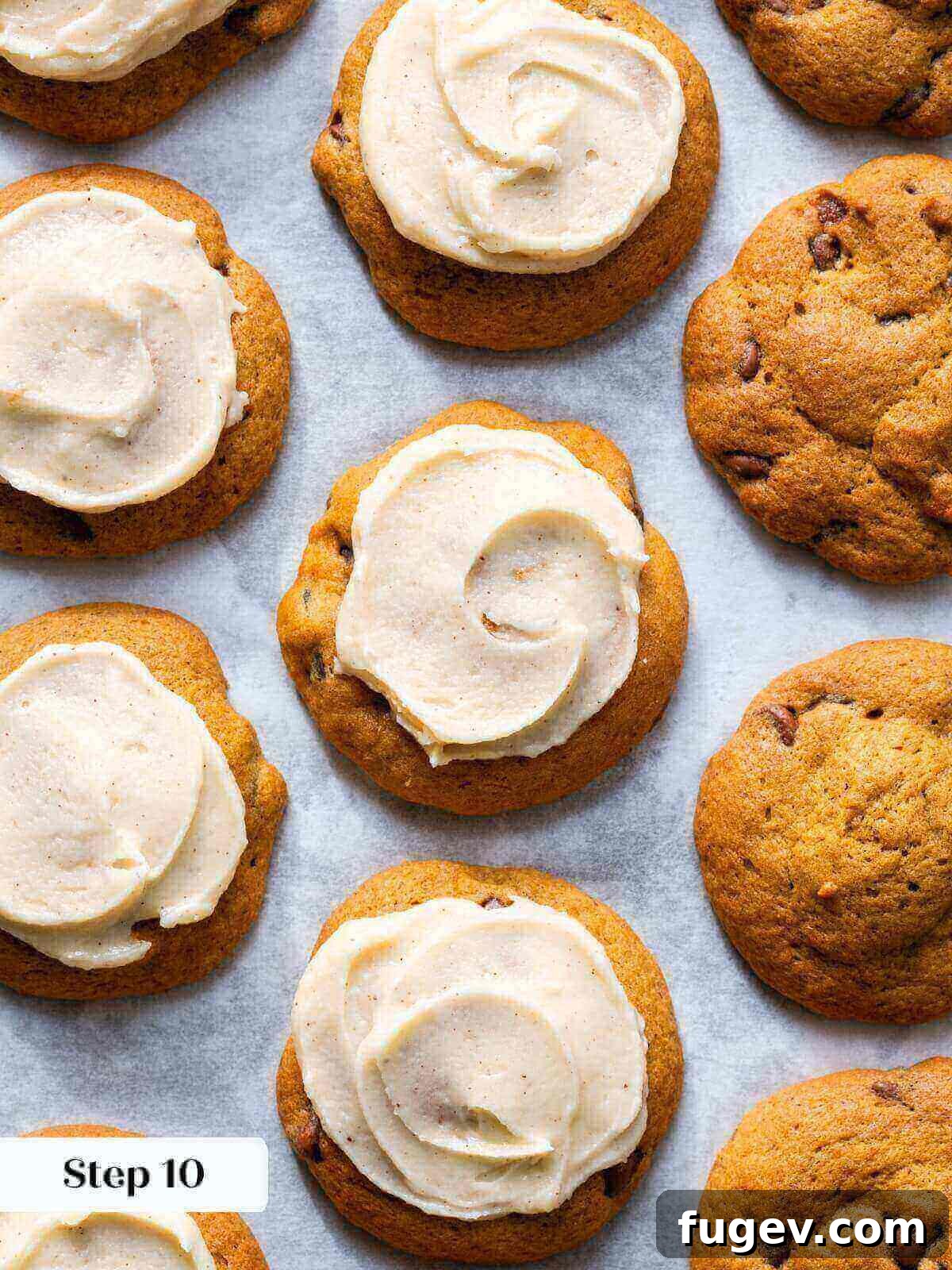 Spiced Pumpkin Chocolate Delights 12 A selection of freshly baked pumpkin chocolate chip cookies, some elegantly iced with browned butter frosting.