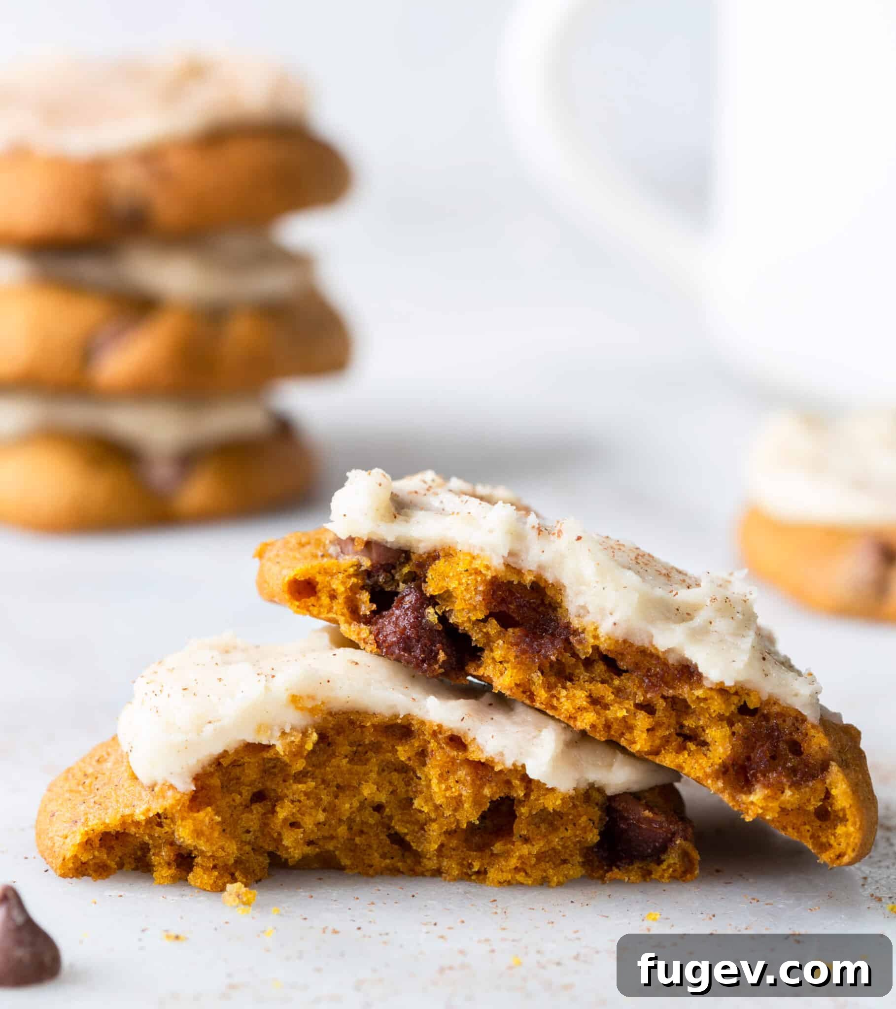 Spiced Pumpkin Chocolate Delights 4 Close-up interior view of a soft and chewy pumpkin chocolate chip cookie with browned butter icing, showcasing its texture and melty chocolate.