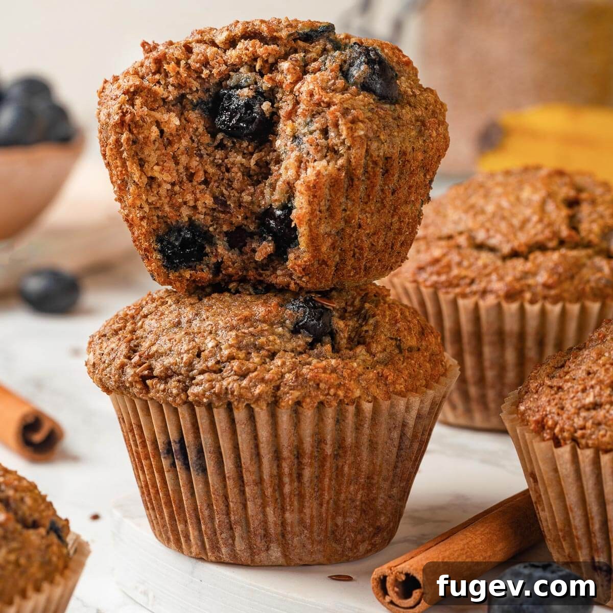 Fiber-Rich Banana Muffins 3 A close-up shot of a banana bran muffin's fluffy, moist crumb texture, showcasing its tender inside.