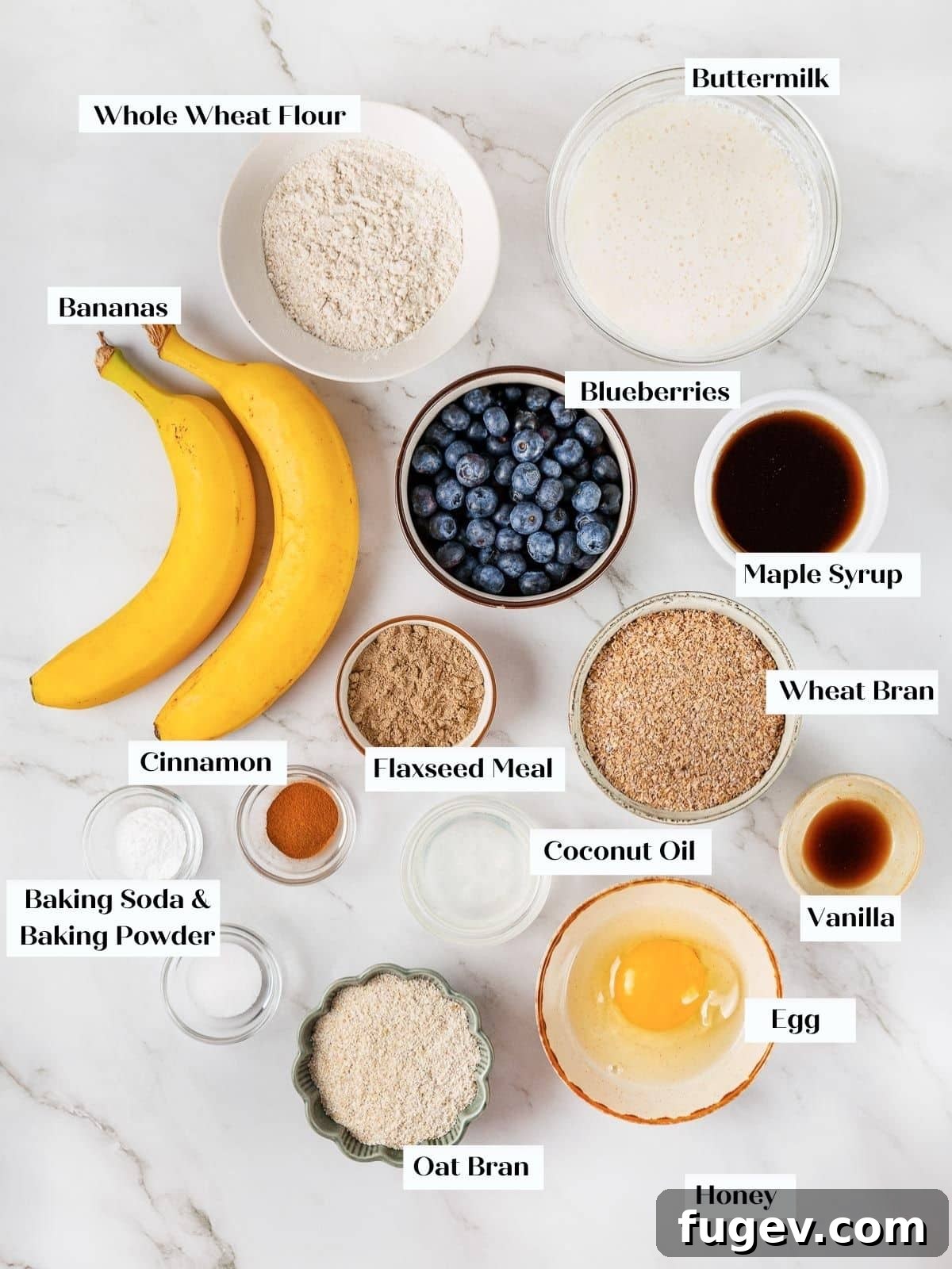 Fiber-Rich Banana Muffins 4 Neatly arranged pre-measured ingredients for banana bran muffins, including flour, oil, and mashed bananas.