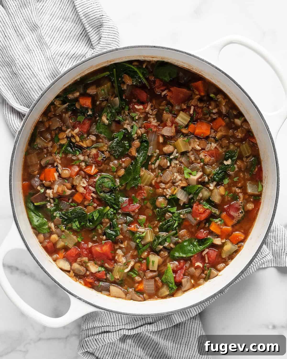 Hearty Lentil Wild Rice Soup 6 A large pot filled with steaming lentil wild rice soup.