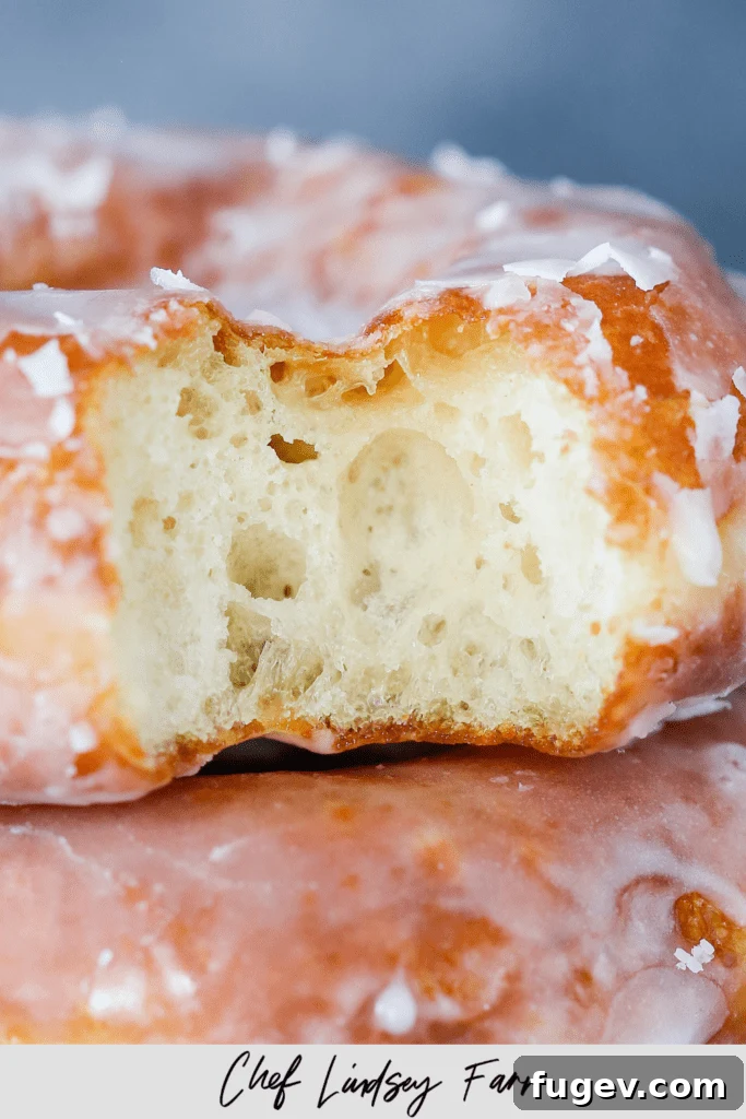 Homemade Krispy Kreme Style Donuts 7 Krispy Kreme Doughnut Recipe (Copycat) - Close up of a single glazed donut.