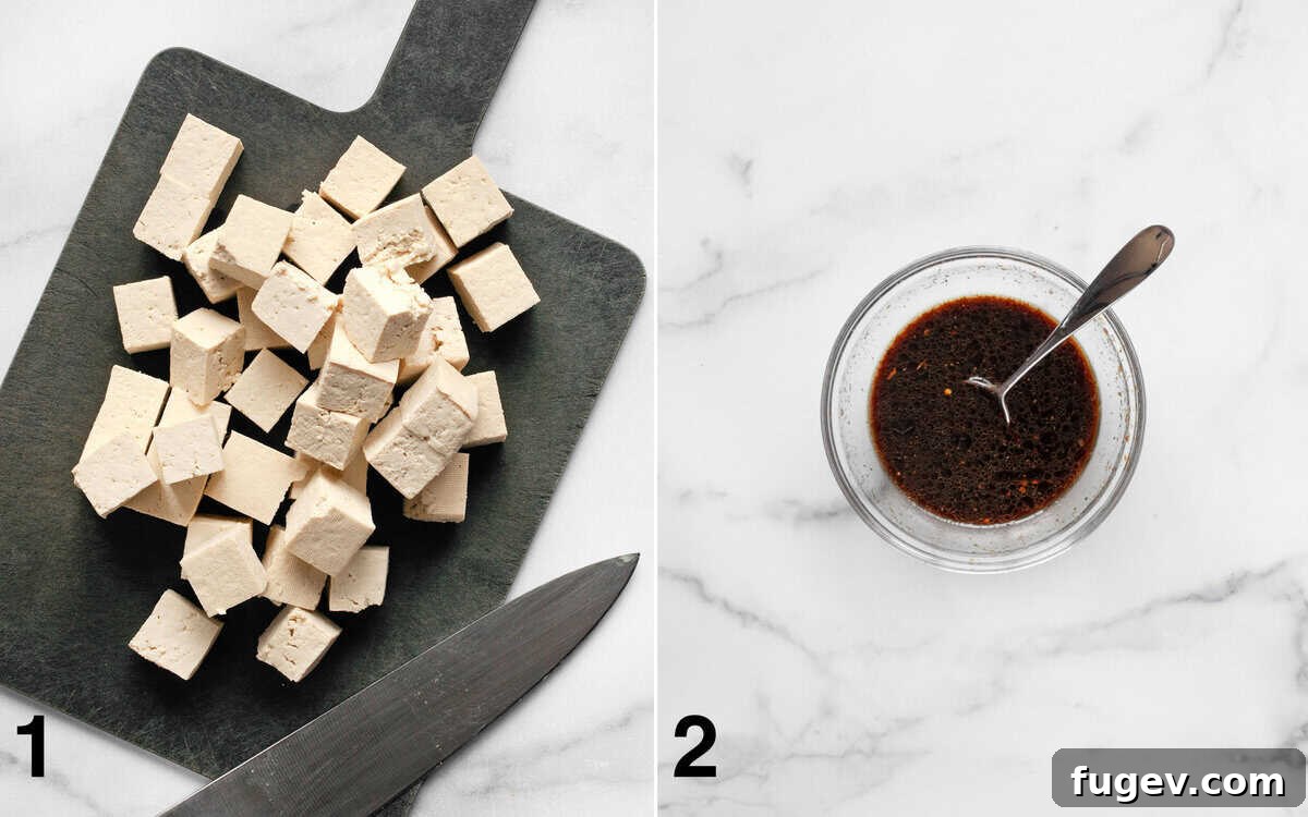 Flavorful Tofu & Veggie Medley 4 Cubed tofu on a cutting board, alongside a small bowl of mixed stir-fry sauce.