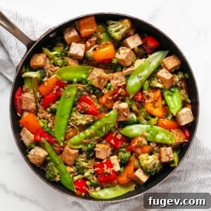 Flavorful Tofu & Veggie Medley 9 Vegetable tofu stir-fry in a skillet.