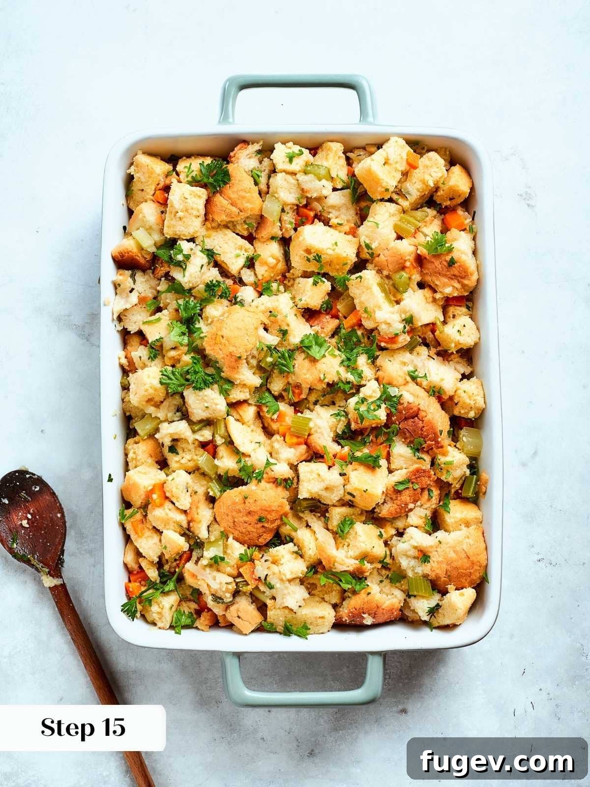 Down-Home Southern Cornbread Dressing 16 Cornbread stuffing mixture with vegetables and herbs arranged evenly in a baking dish ready to bake.