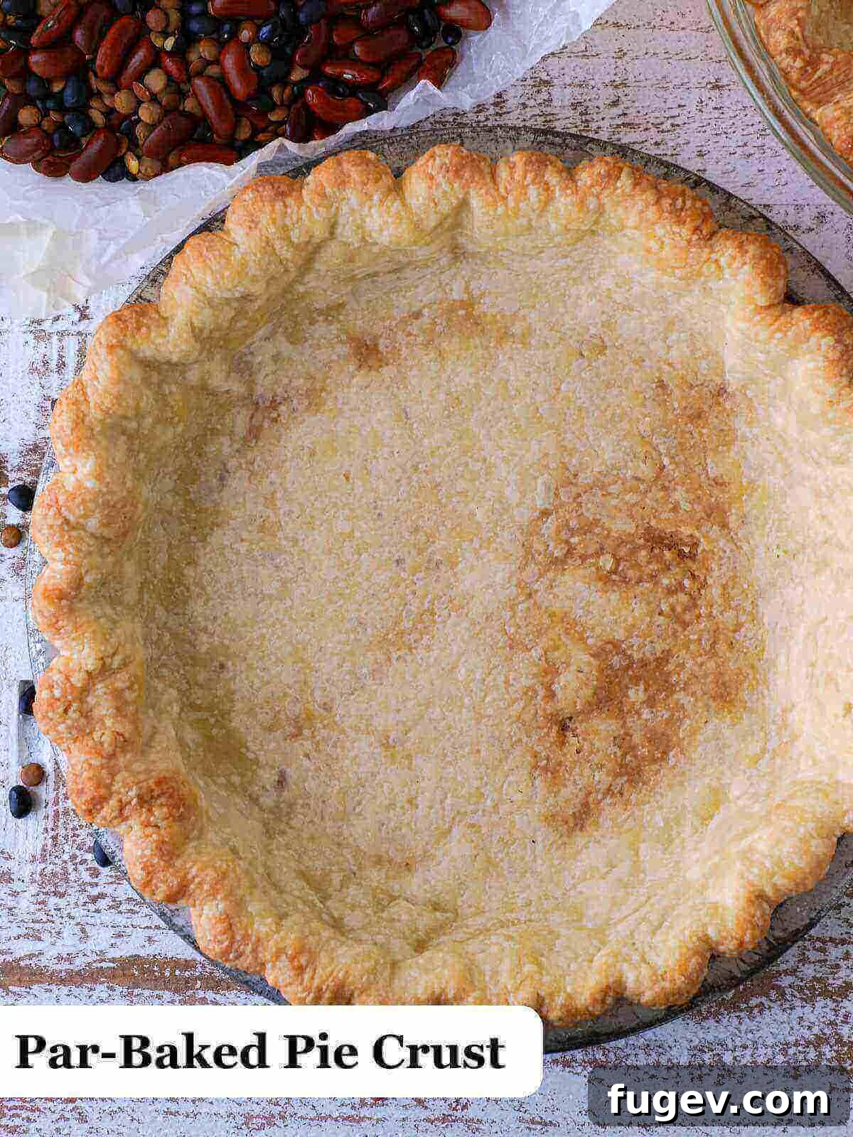 Decadent Chocolate Pecan Pie 8 Text: A golden-brown, partially baked pie crust, ready for filling.