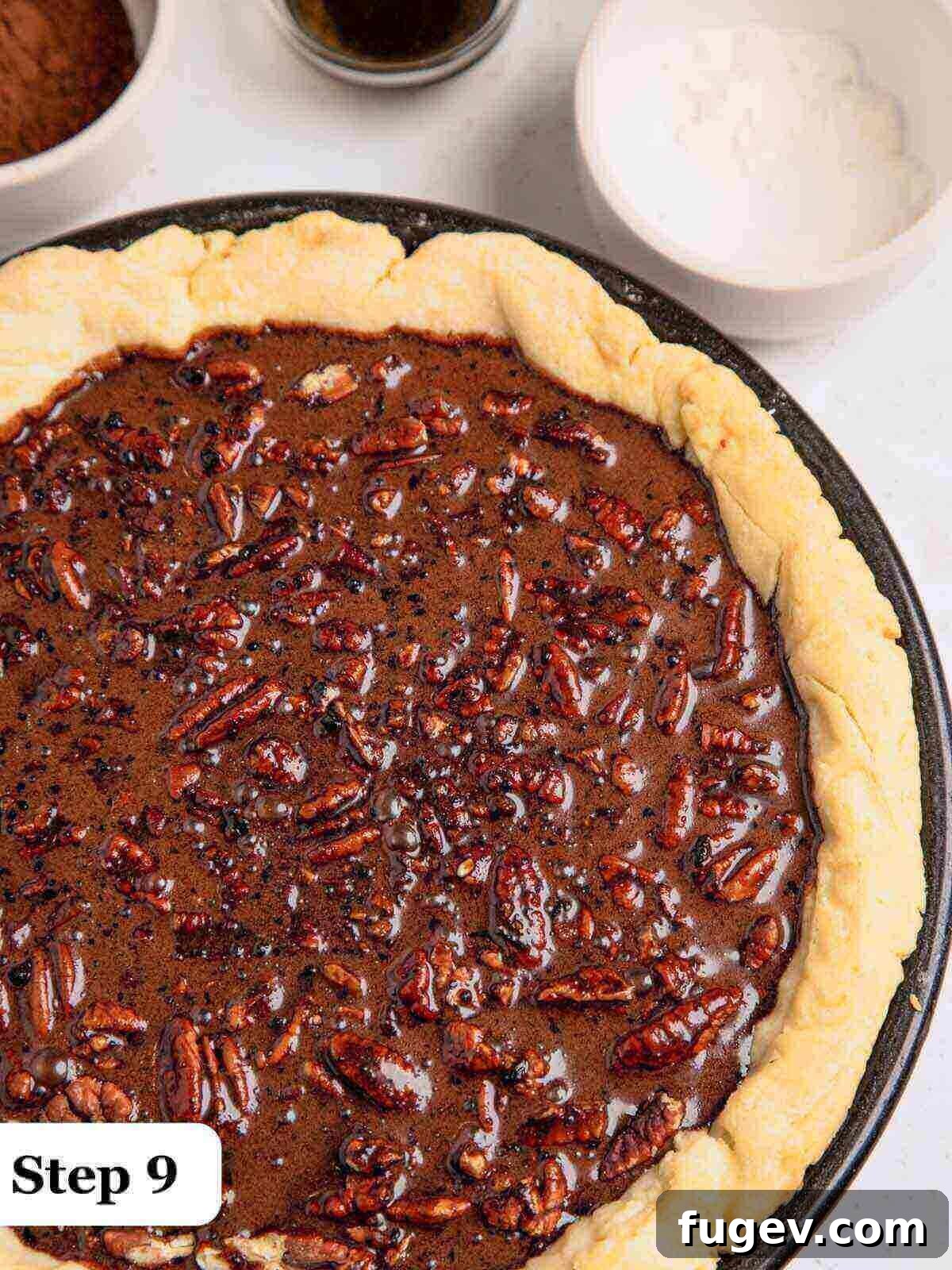 Decadent Chocolate Pecan Pie 10 Text: Step 9, the freshly baked chocolate pecan pie, golden crust, and set chocolate filling, just out of the oven and cooling.