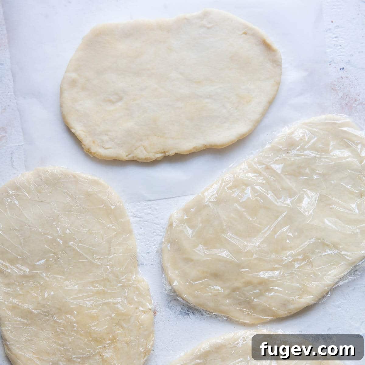 Hungarian Walnut Roll Cookies 9 cream cheese dough wrapped in plastic wrap.