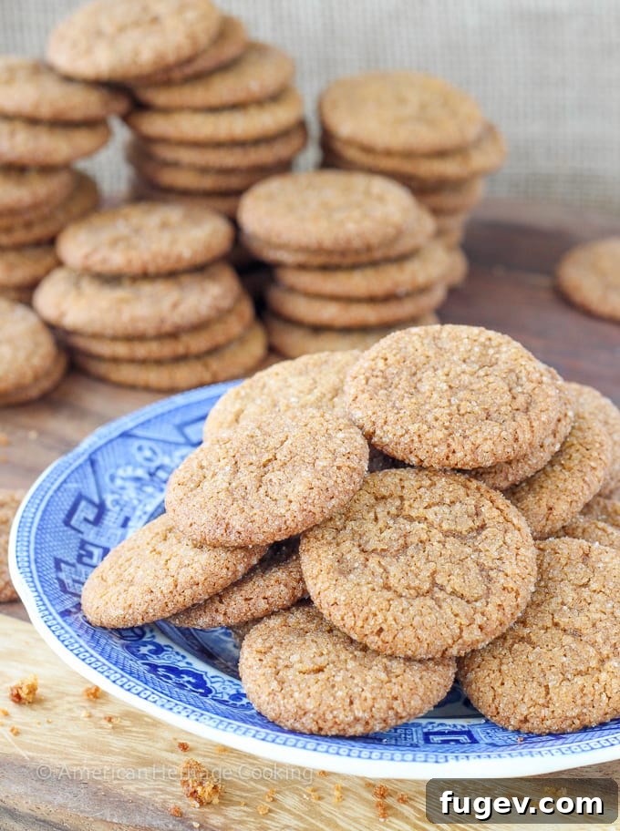 Timeless Gingersnap Cookies 5 A vintage-style glass jar filled with golden, cracked gingersnaps, suggesting a timeless, easy recipe.