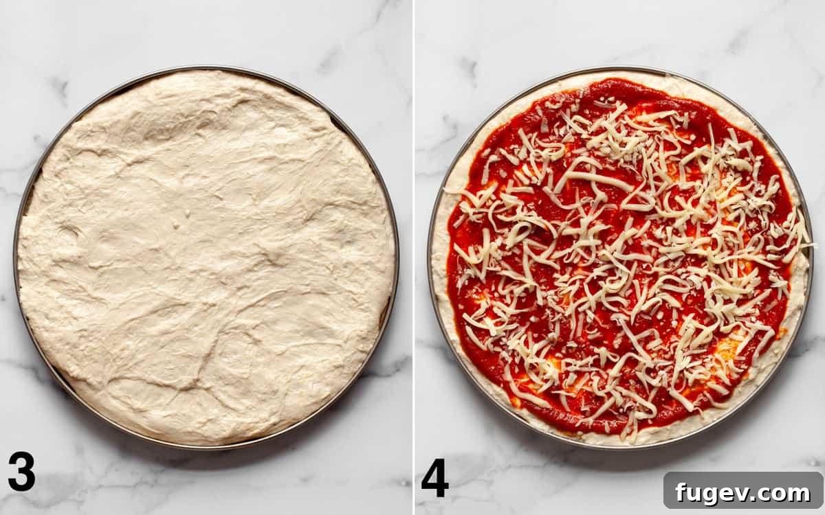 Garden Roast Pizza 5 An image showing pizza dough spread in a pan, topped with a layer of red pizza sauce and a generous sprinkle of shredded cheese.