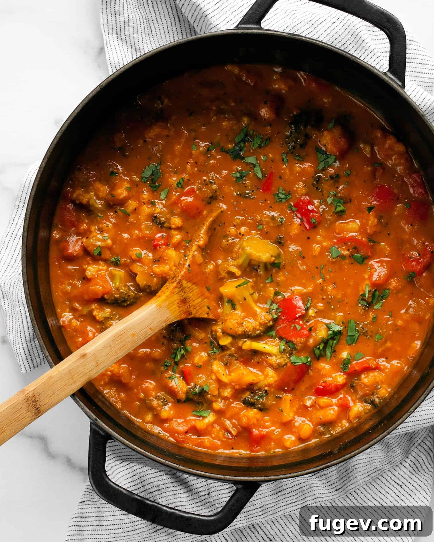 Tropical Garden Coconut Curry 6 Fresh vegetables and aromatic spices cooking in a pot for the curry.