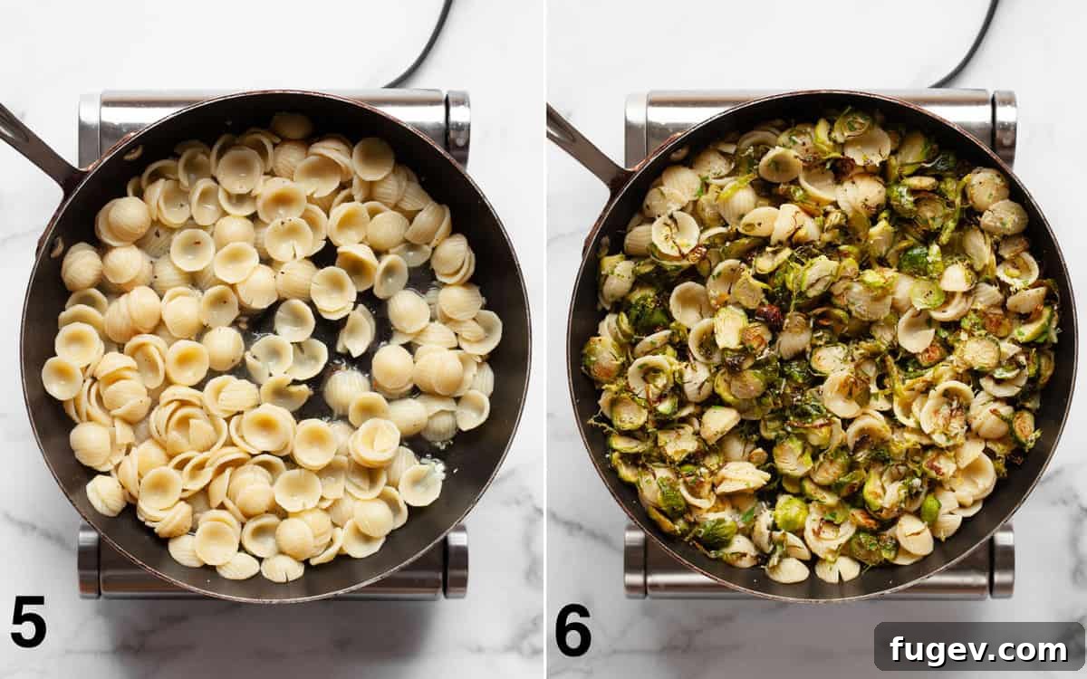 Caramelized Brussels Sprout Pasta 6 The large skillet now holds the cooked orecchiette pasta, glistening as it's tossed with lemon juice, fragrant garlic, and rich olive oil, awaiting the addition of roasted vegetables.
