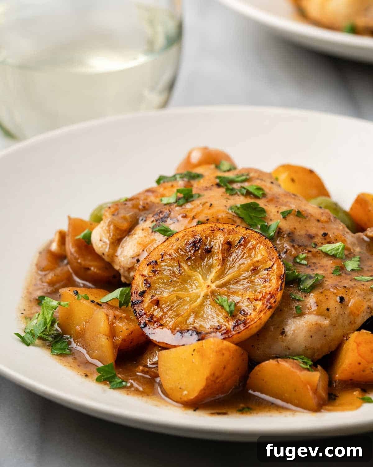 Zesty Lemon Chicken 12 The final lemon chicken dish, beautifully served with Castelvetrano olives and tender potatoes, presented in a large pan for a family-style meal.