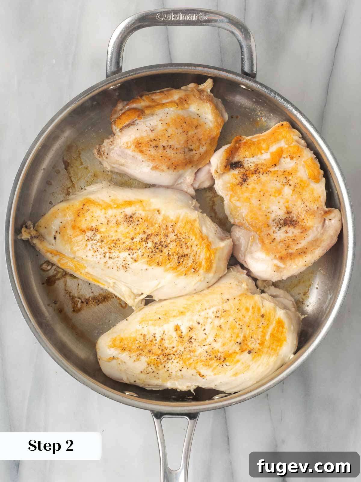 Zesty Lemon Chicken 5 Searing chicken in an oven-safe pan to achieve a delicious golden-brown crust.