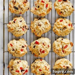 Red Pepper Olive Goat Cheese Biscuits displayed on a kitchen towel.